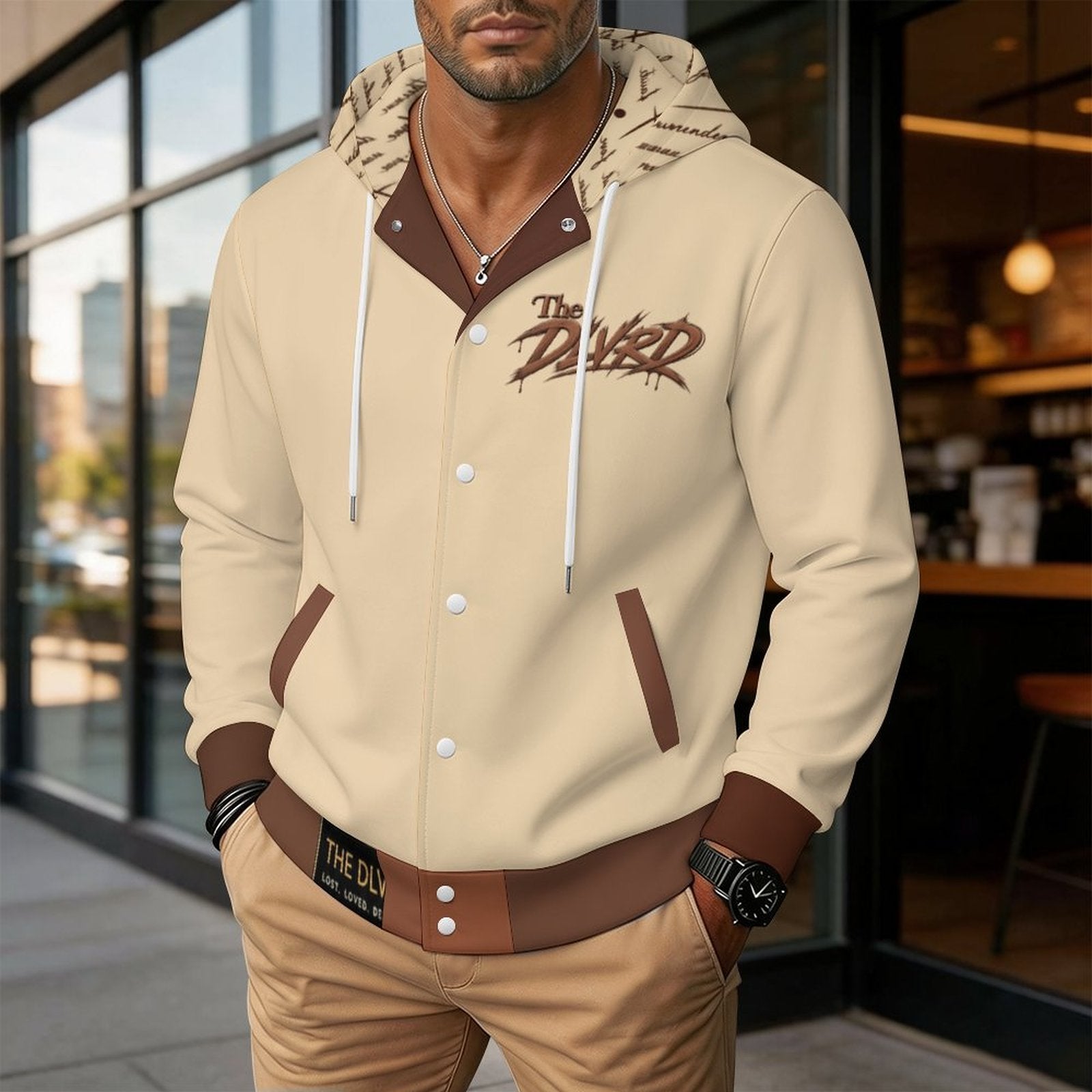 Unisex hooded baseball jacket, light tan with embroidered chest print and brown trim