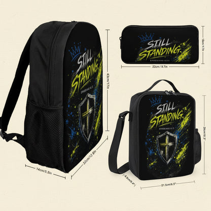 Black backpack, pencil case, and lunch bag set with a matching printed design featuring the text 'STILL STANDING' and a shield graphic, shown with dimension labels on a white background.