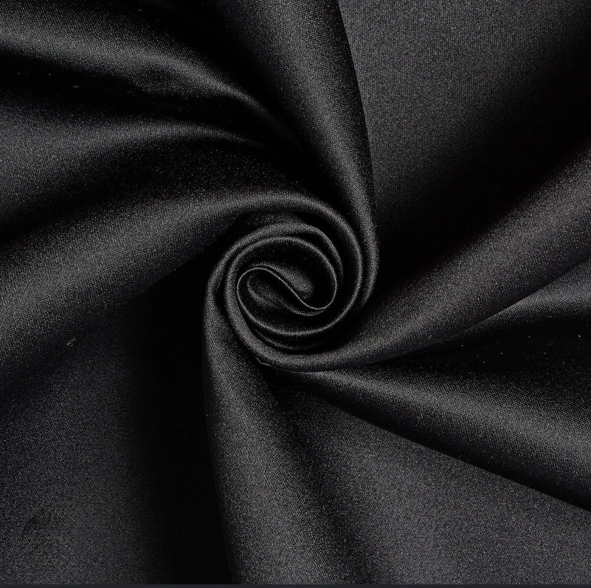 Noir edition tote with matte satin fabric texture, visible drape and subtle sheen