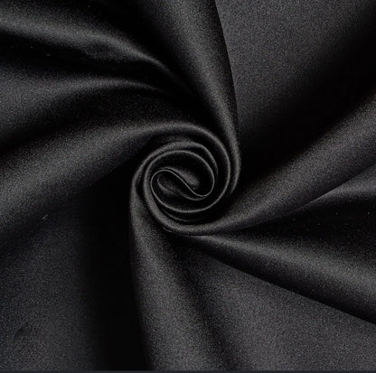 Noir edition tote with matte satin fabric texture, visible drape and subtle sheen