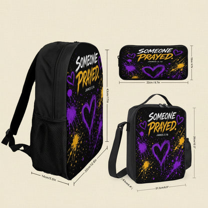 Customized black backpack and matching lunch bag set with a purple and yellow paint splatter design and the text 'SOMEONE PRAYED. JAMES 5:16'.
