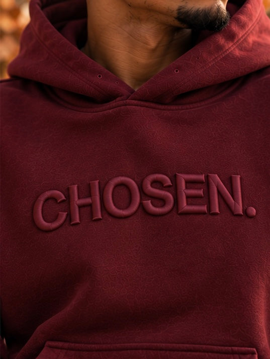 Maroon hoodie front with raised CHOSEN. logo