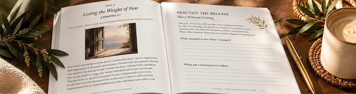 Open devotional workbook showing printed pages with text and section headings