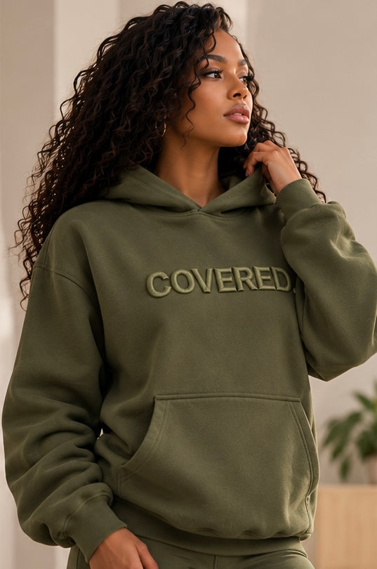 Army green hoodie with COVERED. logo, drawstring hood and front pocket