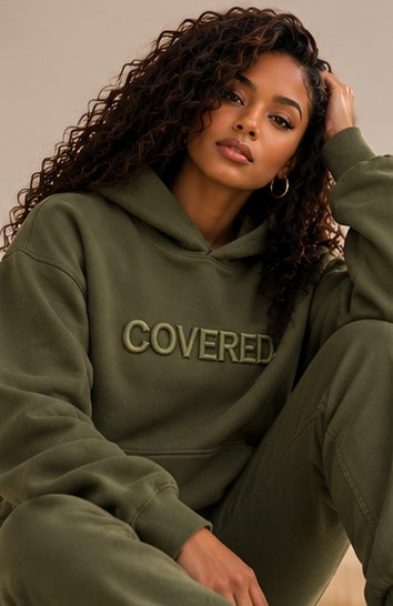 Army green hoodie with COVERED. logo, hood and front kangaroo pocket