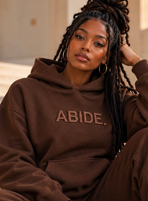 Brown ABIDE hoodie with front logo and kangaroo pocket