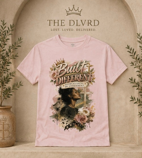 Light pink women’s graphic t-shirt with gold and floral portrait artwork