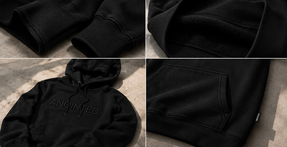 A black pullover hoodie shown in a four-panel collage, highlighting the ribbed cuffs, soft fleece lining, front kangaroo pocket, and tonal embroidered 'ANOINTED' logo on the chest.