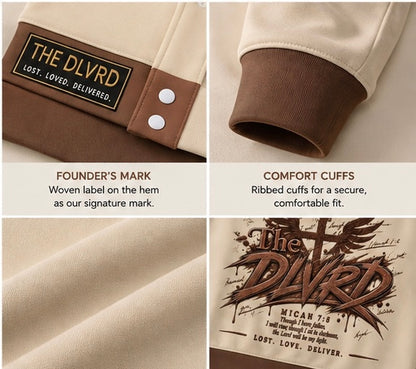 Cream hoodie hem label 'THE DLVRD' and brown ribbed cuffs