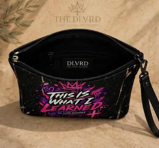 Black crossbody bag with purple graphic text and black strap