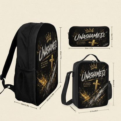 Black backpack, pencil case, and lunch bag set with a gold and white 'UNASHAMED' graphic featuring a crown and cross, shown with dimension lines on a white background.