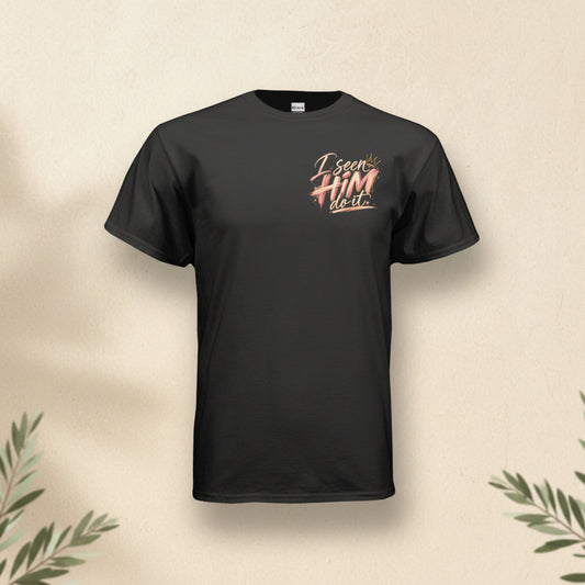 A black short-sleeve t-shirt with a graphic on the left chest that reads 'I saw HIM right' in a stylized pink and gold font, displayed on a clean white background.