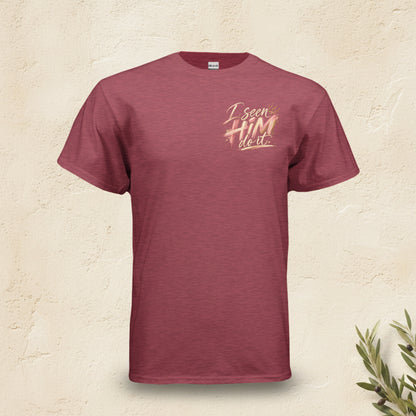 A heathered maroon short-sleeve t-shirt with a gold and white graphic on the left chest that reads 'I see HIM next'.