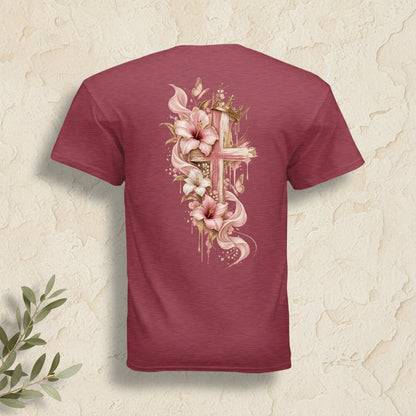 A heathered maroon short-sleeve t-shirt shown from the back, featuring a large graphic print of a gold cross decorated with pink and white lilies and gold leaf details.
