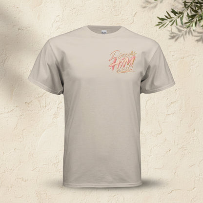 A light beige crewneck t-shirt with a stylized graphic on the left chest reading 'I escape from inside' in a pink and orange textured font, displayed on a clean white background.