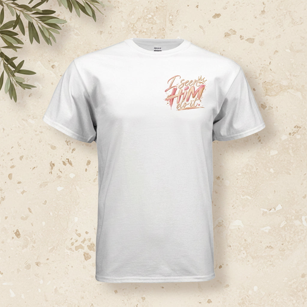 A white short-sleeve crewneck t-shirt with a stylized graphic on the left chest reading 'I see you FIRM video' in a pink and orange brush-stroke font, shown on a plain white background.